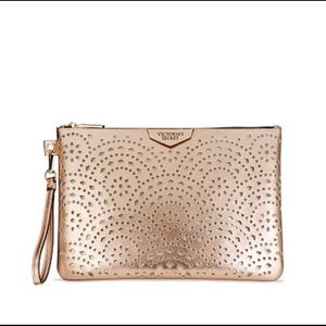 Victoria's Secret Bags - NWT ROSE GOLD VICTORIAS SECRET LARGE WRISTLET Victoria's Secret Bags - NWT ROSE GOLD VICTORIAS SECRET LARGE WRISTLET